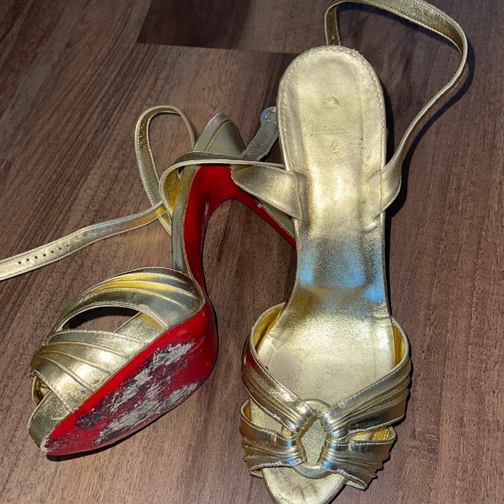 Gold Christian Louboutin heels